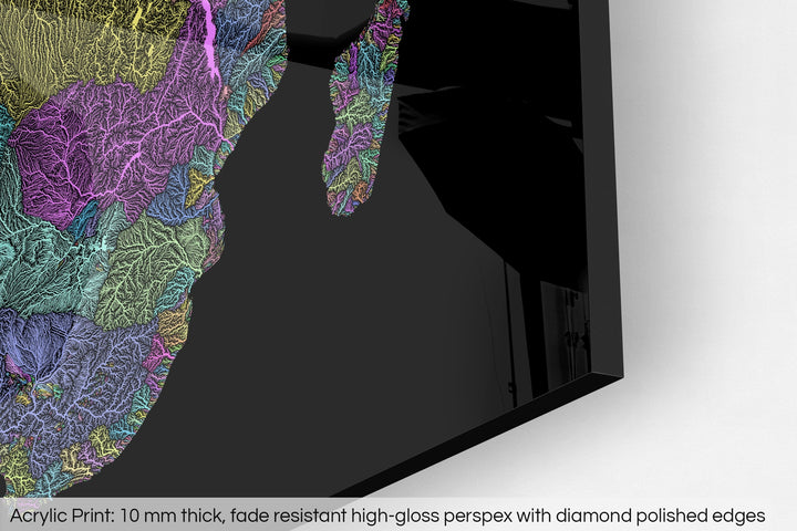 Closeup of an acrylic panel's corner, the details of a Grasshopper Geography map is visible. The text at the bottom reads: Acrylic print - 10 mm thick, fade reistant high-gloss perspex with diamond polished edges.