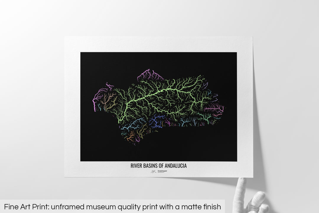 Unframed fine art print of a colourful map with a thick white mat. The title of the map and the Grasshopper Geography logo is printed on the mat, below the image. The map print lies flat on a white surface, a hand holding up one of the corners. The bottom text reads: Fine art print - unframed museum quality print with a matte finish.