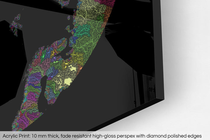 Closeup of an acrylic panel's corner, the details of a Grasshopper Geography map is visible. The text at the bottom reads: Acrylic print - 10 mm thick, fade reistant high-gloss perspex with diamond polished edges.