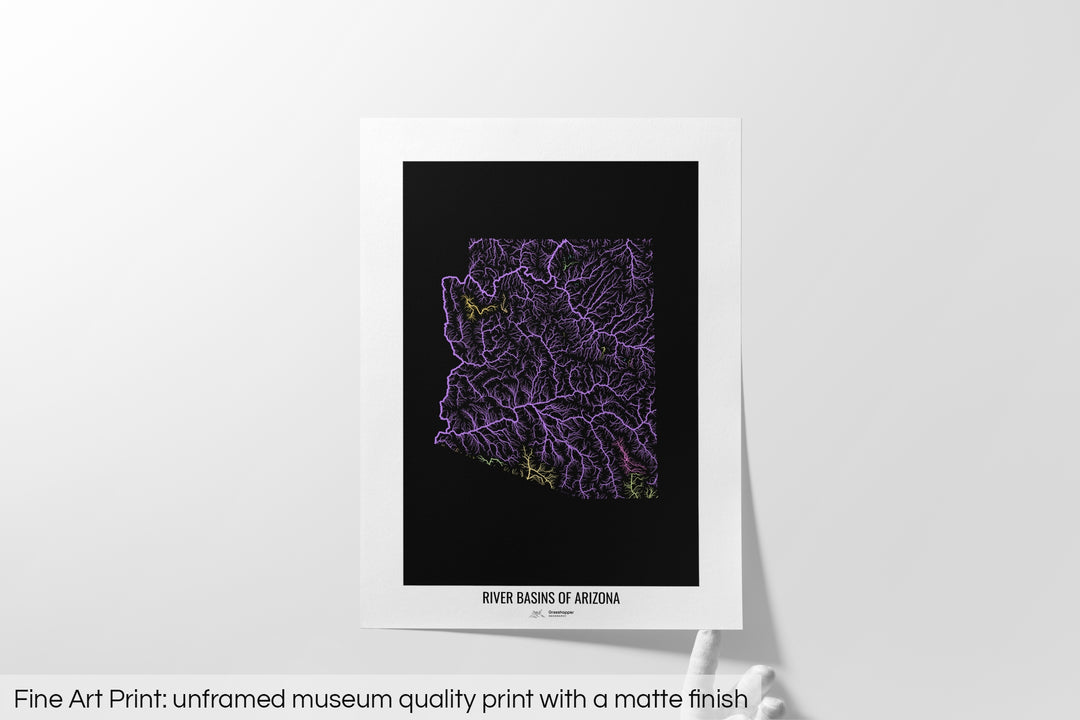 Unframed fine art print of a colourful map with a thick white mat. The title of the map and the Grasshopper Geography logo is printed on the mat, below the image. The map print lies flat on a white surface, a hand holding up one of the corners. The bottom text reads: Fine art print - unframed museum quality print with a matte finish.