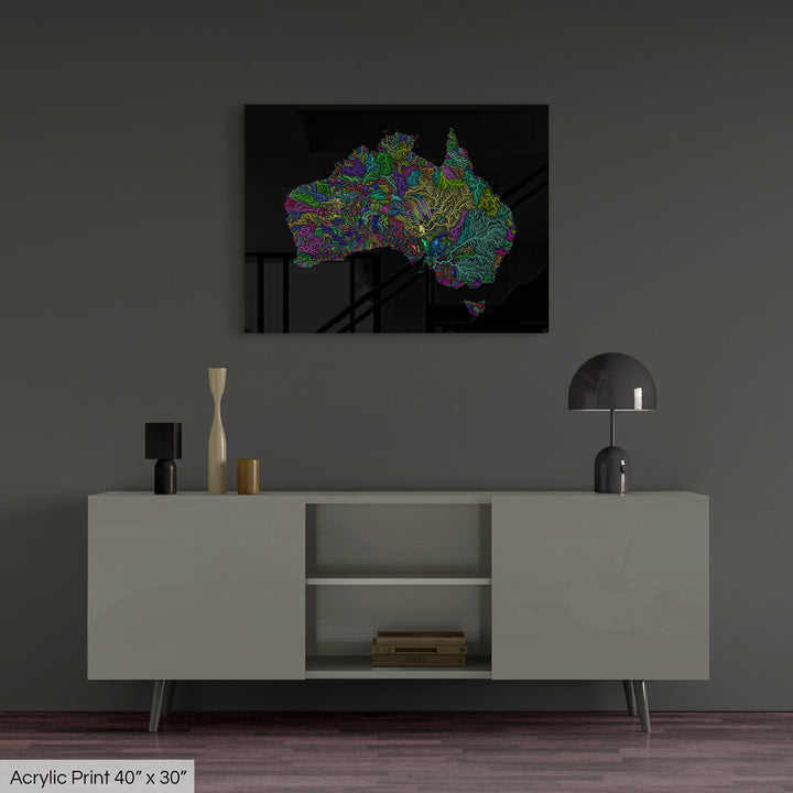 A colourful Grasshopper Geography map, home decor hanging on a grey wall in a living room. The map is printed on an acrylic panel and hangs above a modern low storage cabinet.