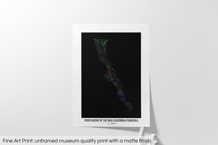 Unframed fine art print of a colourful map with a thick white mat. The title of the map and the Grasshopper Geography logo is printed on the mat, below the image. The map print lies flat on a white surface, a hand holding up one of the corners. The bottom text reads: Fine art print - unframed museum quality print with a matte finish.