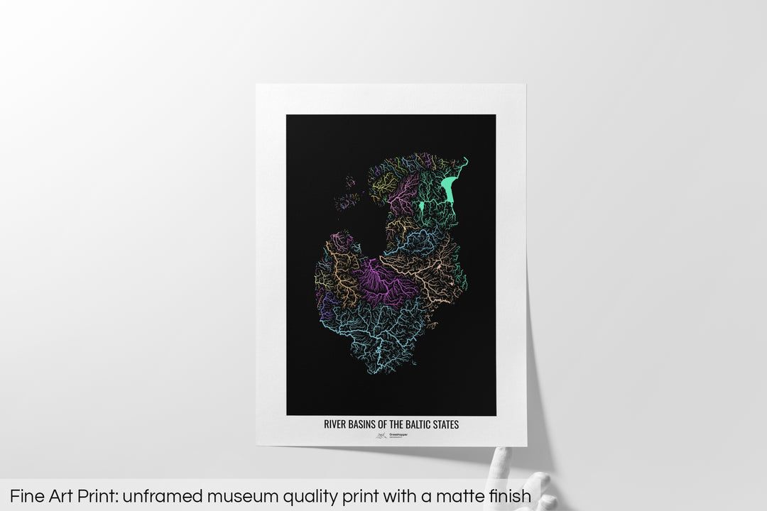 Unframed fine art print of a colourful map with a thick white mat. The title of the map and the Grasshopper Geography logo is printed on the mat, below the image. The map print lies flat on a white surface, a hand holding up one of the corners. The bottom text reads: Fine art print - unframed museum quality print with a matte finish.