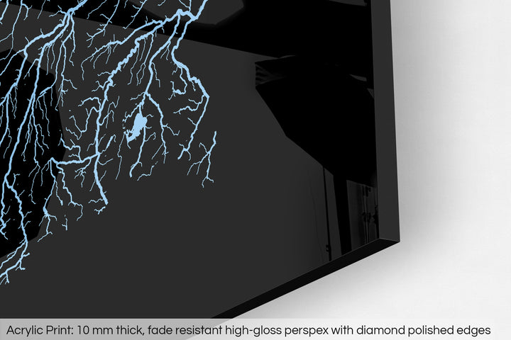 Closeup of an acrylic panel's corner, the details of a Grasshopper Geography map is visible. The text at the bottom reads: Acrylic print - 10 mm thick, fade reistant high-gloss perspex with diamond polished edges.