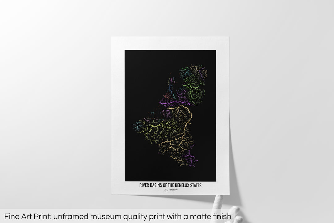 Unframed fine art print of a colourful map with a thick white mat. The title of the map and the Grasshopper Geography logo is printed on the mat, below the image. The map print lies flat on a white surface, a hand holding up one of the corners. The bottom text reads: Fine art print - unframed museum quality print with a matte finish.