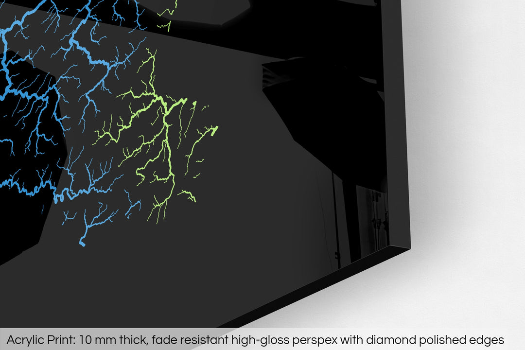 Closeup of an acrylic panel's corner, the details of a Grasshopper Geography map is visible. The text at the bottom reads: Acrylic print - 10 mm thick, fade reistant high-gloss perspex with diamond polished edges.