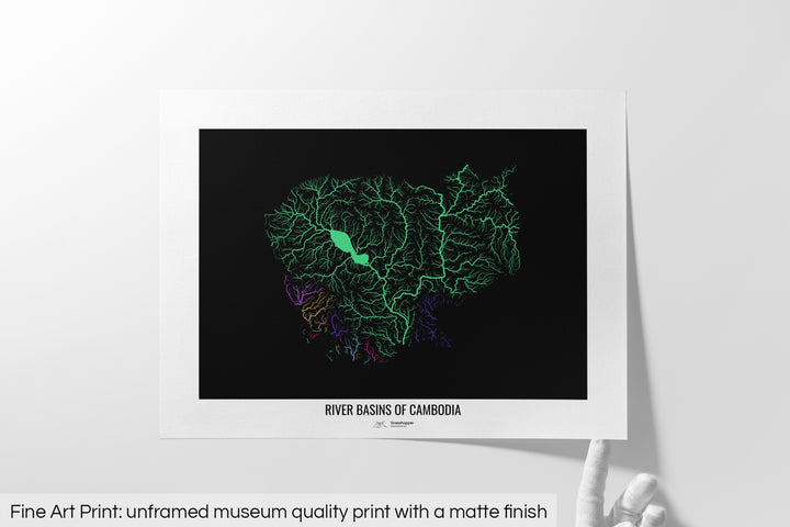 Unframed fine art print of a colourful map with a thick white mat. The title of the map and the Grasshopper Geography logo is printed on the mat, below the image. The map print lies flat on a white surface, a hand holding up one of the corners. The bottom text reads: Fine art print - unframed museum quality print with a matte finish.