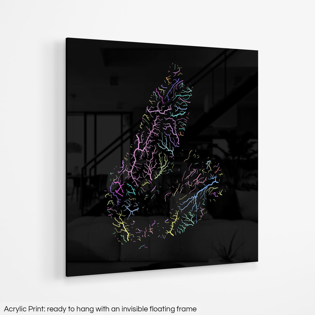 A colourful Grasshopper Geography map hanging on a white wall. The text at the bottom reads: Acrylic print - ready to hang with an invisible floating frame.