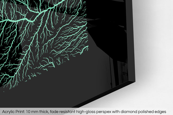 Closeup of an acrylic panel's corner, the details of a Grasshopper Geography map is visible. The text at the bottom reads: Acrylic print - 10 mm thick, fade reistant high-gloss perspex with diamond polished edges.