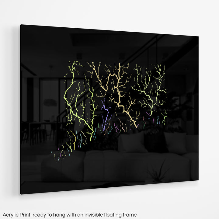 A colourful Grasshopper Geography map hanging on a white wall. The text at the bottom reads: Acrylic print - ready to hang with an invisible floating frame.