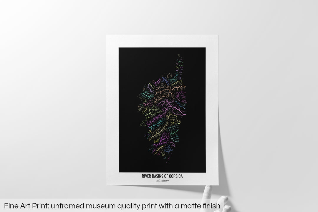 Unframed fine art print of a colourful map with a thick white mat. The title of the map and the Grasshopper Geography logo is printed on the mat, below the image. The map print lies flat on a white surface, a hand holding up one of the corners. The bottom text reads: Fine art print - unframed museum quality print with a matte finish.