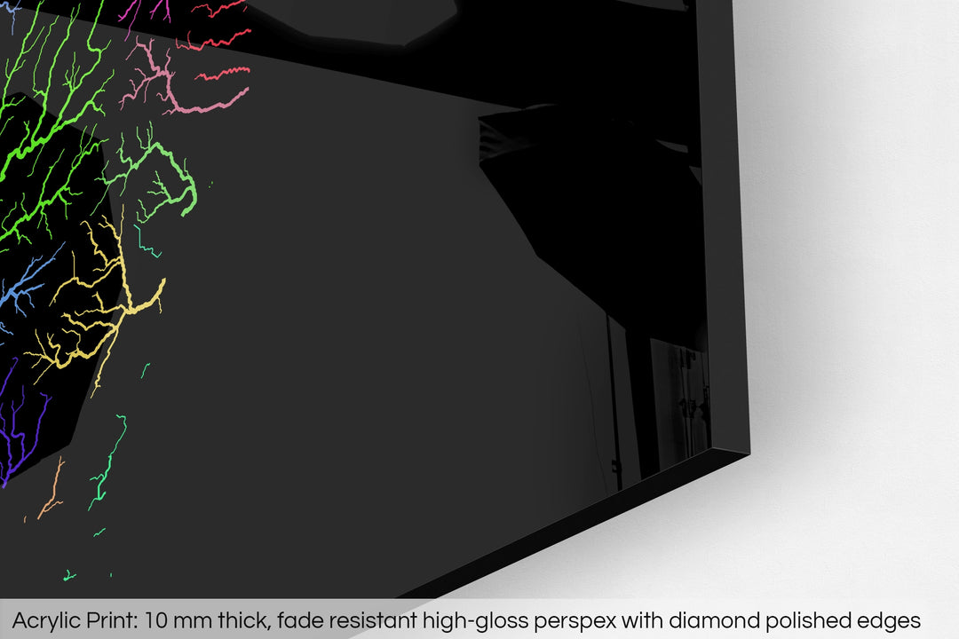 Closeup of an acrylic panel's corner, the details of a Grasshopper Geography map is visible. The text at the bottom reads: Acrylic print - 10 mm thick, fade reistant high-gloss perspex with diamond polished edges.