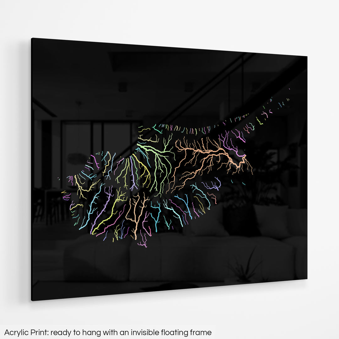 A colourful Grasshopper Geography map hanging on a white wall. The text at the bottom reads: Acrylic print - ready to hang with an invisible floating frame.