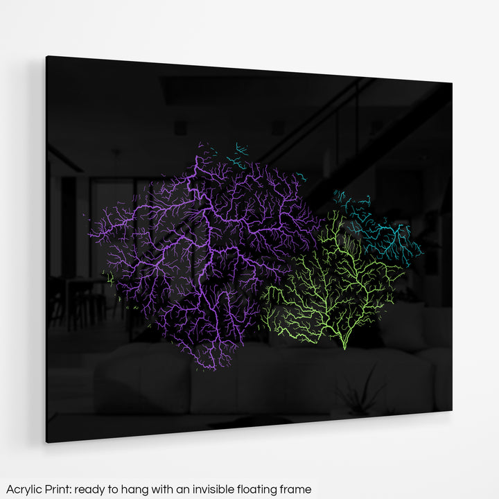 A colourful Grasshopper Geography map hanging on a white wall. The text at the bottom reads: Acrylic print - ready to hang with an invisible floating frame.