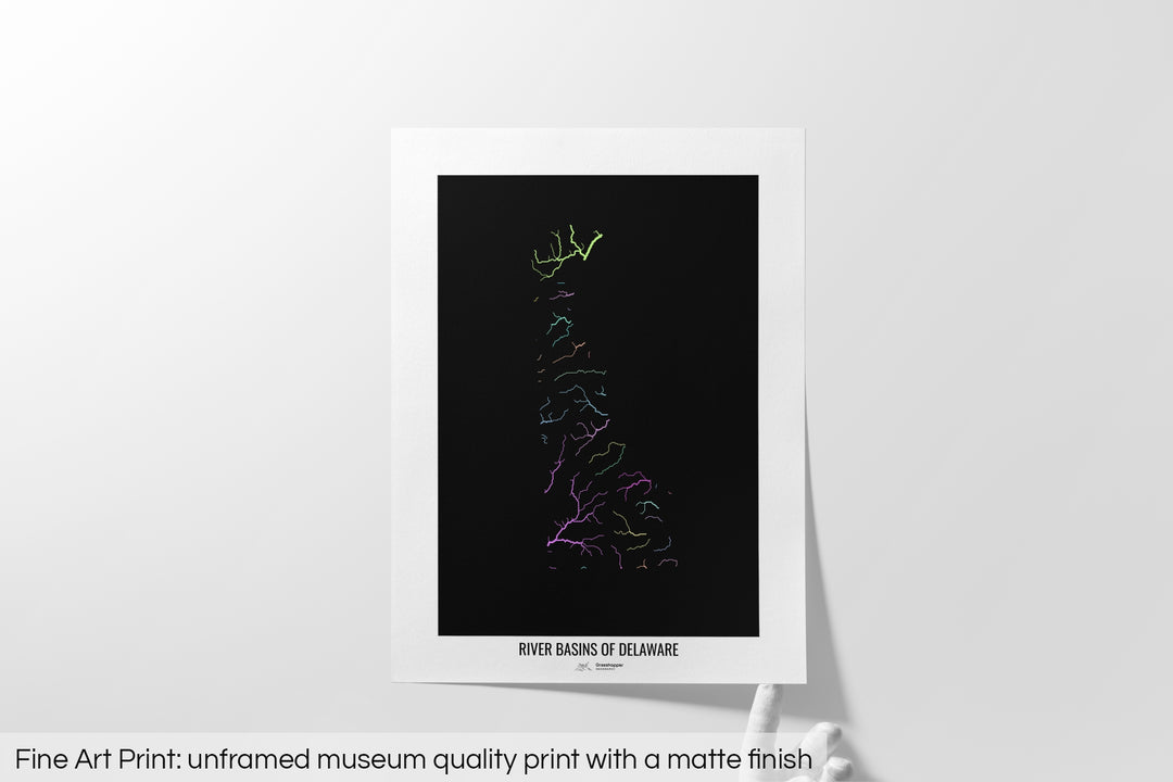 Unframed fine art print of a colourful map with a thick white mat. The title of the map and the Grasshopper Geography logo is printed on the mat, below the image. The map print lies flat on a white surface, a hand holding up one of the corners. The bottom text reads: Fine art print - unframed museum quality print with a matte finish.