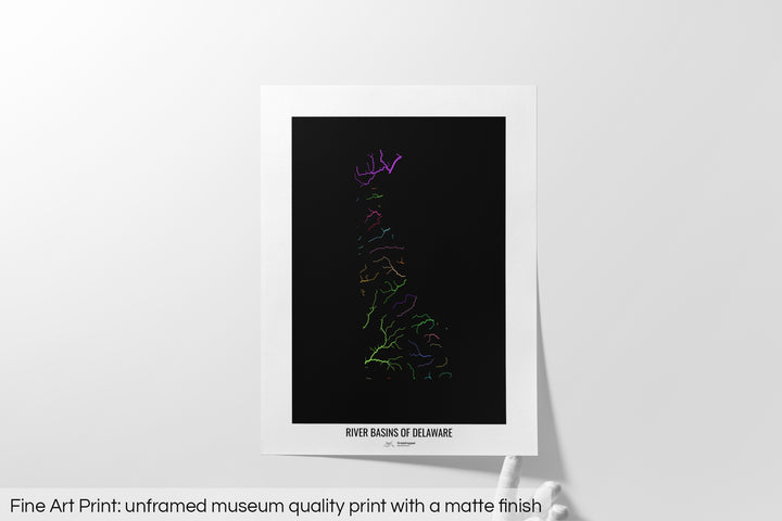 Unframed fine art print of a colourful map with a thick white mat. The title of the map and the Grasshopper Geography logo is printed on the mat, below the image. The map print lies flat on a white surface, a hand holding up one of the corners. The bottom text reads: Fine art print - unframed museum quality print with a matte finish.