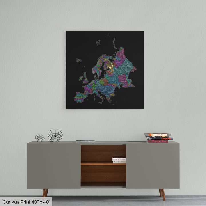 A colourful Grasshopper Geography map home decor in a living room, on a light grey wall. The map is printed on canvas and hangs above a modern low storage cabinet.