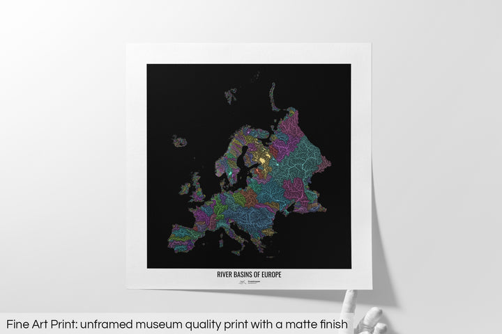 Unframed fine art print of a colourful map with a thick white mat. The title of the map and the Grasshopper Geography logo is printed on the mat, below the image. The map print lies flat on a white surface, a hand holding up one of the corners. The bottom text reads: Fine art print - unframed museum quality print with a matte finish.