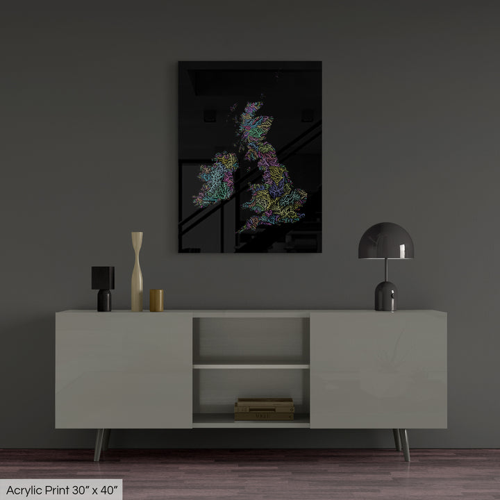 A colourful Grasshopper Geography map, home decor hanging on a grey wall in a living room. The map is printed on an acrylic panel and hangs above a modern low storage cabinet.