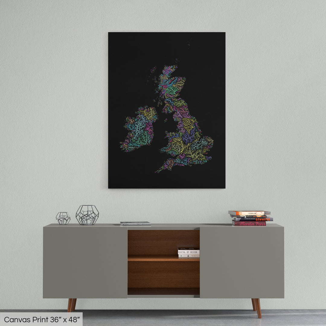 A colourful Grasshopper Geography map home decor in a living room, on a light grey wall. The map is printed on canvas and hangs above a modern low storage cabinet.