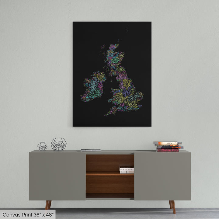 A colourful Grasshopper Geography map home decor in a living room, on a light grey wall. The map is printed on canvas and hangs above a modern low storage cabinet.