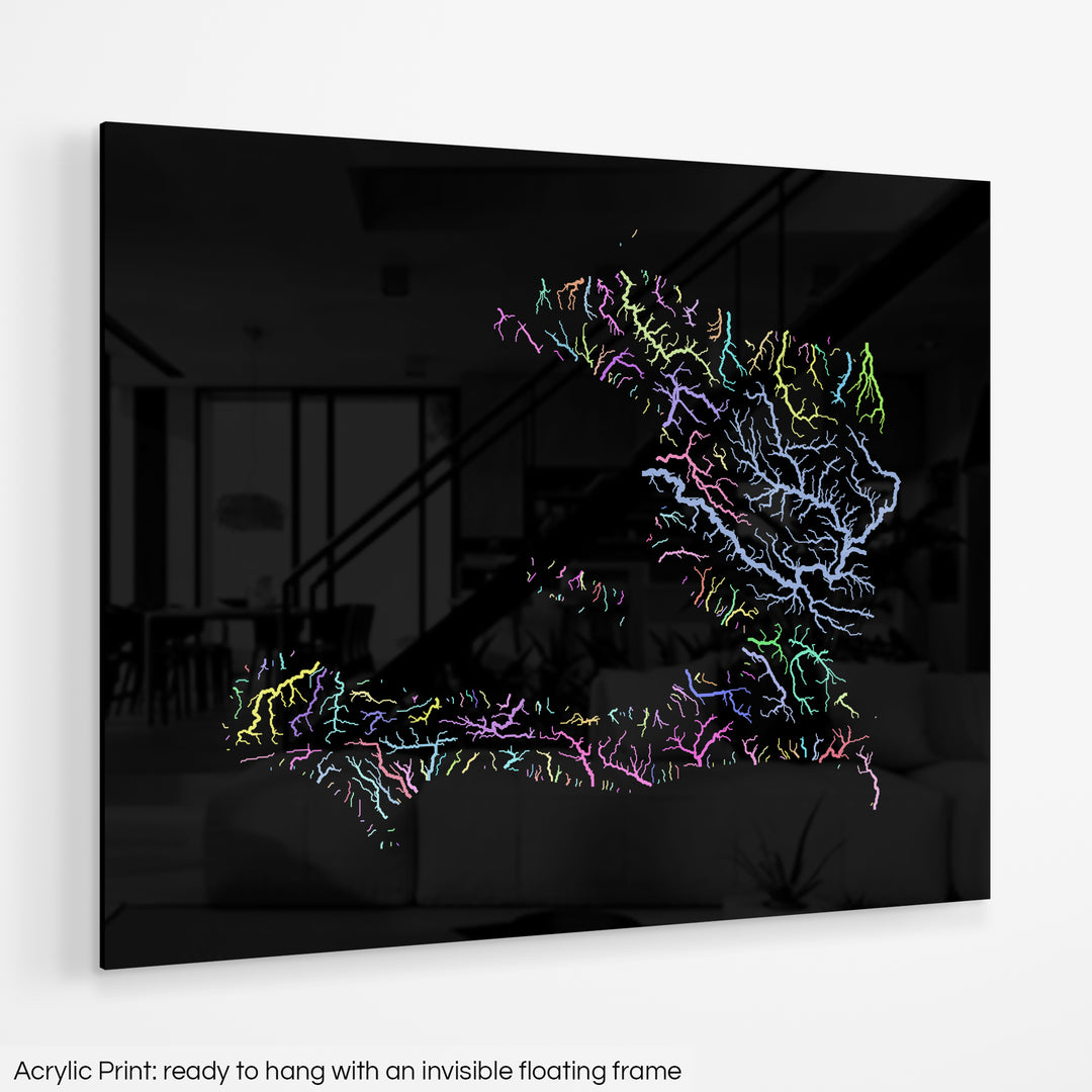 A colourful Grasshopper Geography map hanging on a white wall. The text at the bottom reads: Acrylic print - ready to hang with an invisible floating frame.