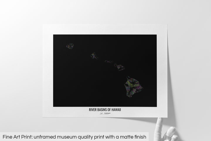 Unframed fine art print of a colourful map with a thick white mat. The title of the map and the Grasshopper Geography logo is printed on the mat, below the image. The map print lies flat on a white surface, a hand holding up one of the corners. The bottom text reads: Fine art print - unframed museum quality print with a matte finish.