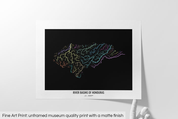 Unframed fine art print of a colourful map with a thick white mat. The title of the map and the Grasshopper Geography logo is printed on the mat, below the image. The map print lies flat on a white surface, a hand holding up one of the corners. The bottom text reads: Fine art print - unframed museum quality print with a matte finish.