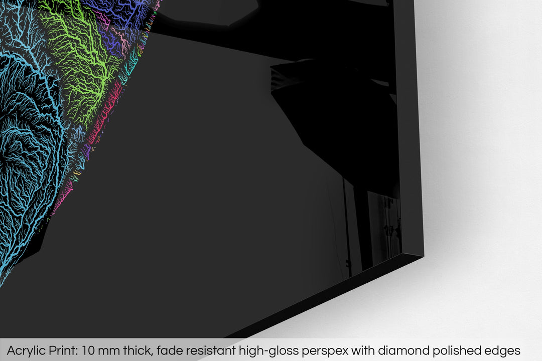 Closeup of an acrylic panel's corner, the details of a Grasshopper Geography map is visible. The text at the bottom reads: Acrylic print - 10 mm thick, fade reistant high-gloss perspex with diamond polished edges.