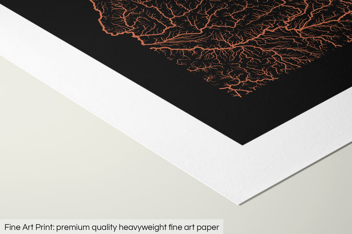 Closeup of a fine art print's corner lying on a flat surface, the details of a Grasshopper Geography map is visible. The text at the bottom reads: Fine art print - premium quality heavyweight fine art paper.