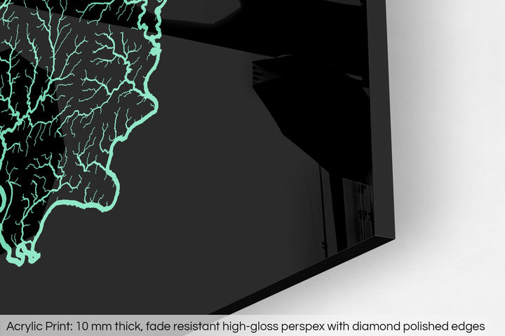 Closeup of an acrylic panel's corner, the details of a Grasshopper Geography map is visible. The text at the bottom reads: Acrylic print - 10 mm thick, fade reistant high-gloss perspex with diamond polished edges.