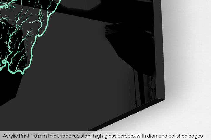 Closeup of an acrylic panel's corner, the details of a Grasshopper Geography map is visible. The text at the bottom reads: Acrylic print - 10 mm thick, fade reistant high-gloss perspex with diamond polished edges.