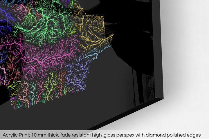 Closeup of an acrylic panel's corner, the details of a Grasshopper Geography map is visible. The text at the bottom reads: Acrylic print - 10 mm thick, fade reistant high-gloss perspex with diamond polished edges.