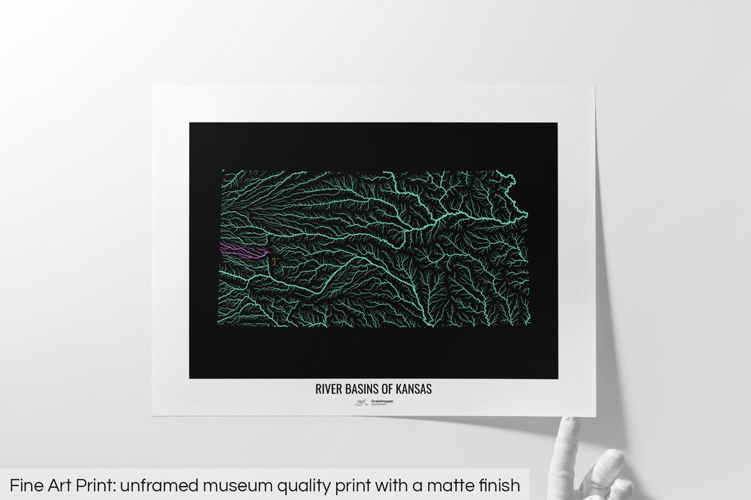 Unframed fine art print of a colourful map with a thick white mat. The title of the map and the Grasshopper Geography logo is printed on the mat, below the image. The map print lies flat on a white surface, a hand holding up one of the corners. The bottom text reads: Fine art print - unframed museum quality print with a matte finish.