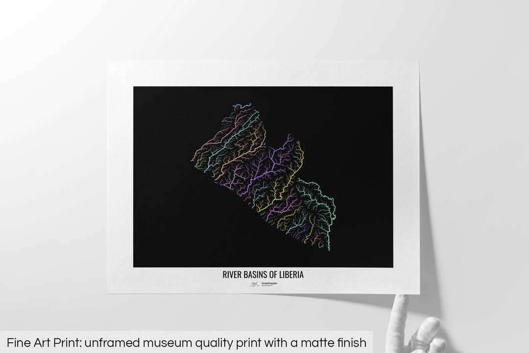 Unframed fine art print of a colourful map with a thick white mat. The title of the map and the Grasshopper Geography logo is printed on the mat, below the image. The map print lies flat on a white surface, a hand holding up one of the corners. The bottom text reads: Fine art print - unframed museum quality print with a matte finish.