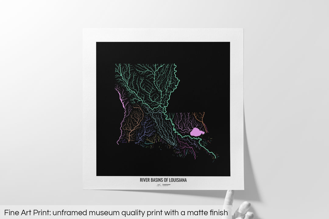 Unframed fine art print of a colourful map with a thick white mat. The title of the map and the Grasshopper Geography logo is printed on the mat, below the image. The map print lies flat on a white surface, a hand holding up one of the corners. The bottom text reads: Fine art print - unframed museum quality print with a matte finish.
