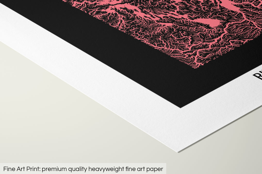 Closeup of a fine art print's corner lying on a flat surface, the details of a Grasshopper Geography map is visible. The text at the bottom reads: Fine art print - premium quality heavyweight fine art paper.