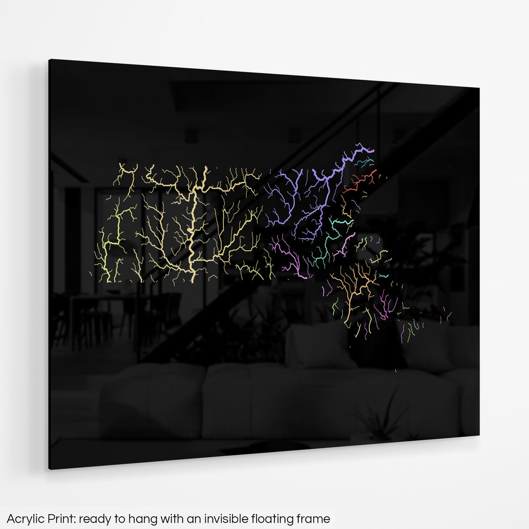 A colourful Grasshopper Geography map hanging on a white wall. The text at the bottom reads: Acrylic print - ready to hang with an invisible floating frame.