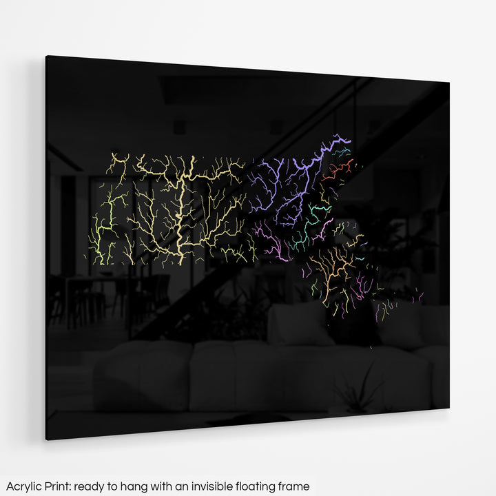 A colourful Grasshopper Geography map hanging on a white wall. The text at the bottom reads: Acrylic print - ready to hang with an invisible floating frame.