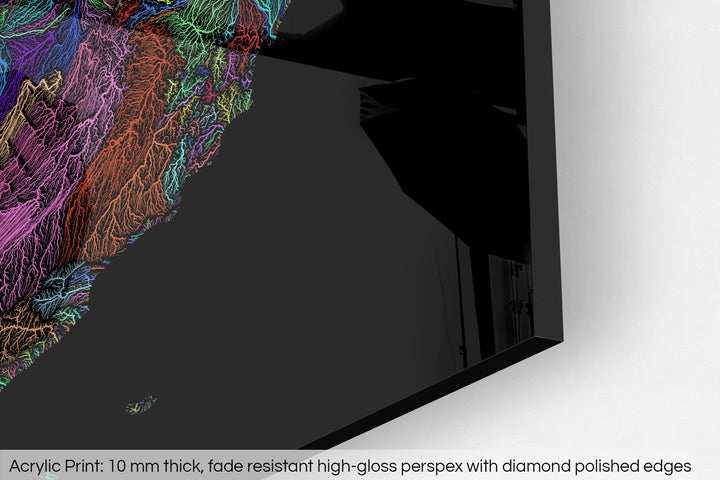 Closeup of an acrylic panel's corner, the details of a Grasshopper Geography map is visible. The text at the bottom reads: Acrylic print - 10 mm thick, fade reistant high-gloss perspex with diamond polished edges.