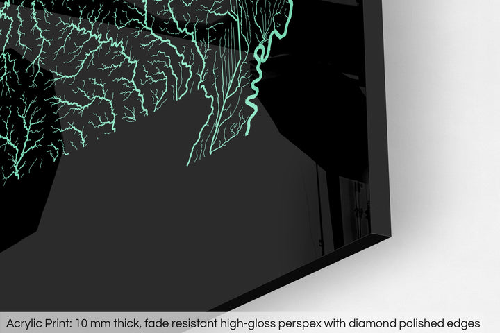 Closeup of an acrylic panel's corner, the details of a Grasshopper Geography map is visible. The text at the bottom reads: Acrylic print - 10 mm thick, fade reistant high-gloss perspex with diamond polished edges.