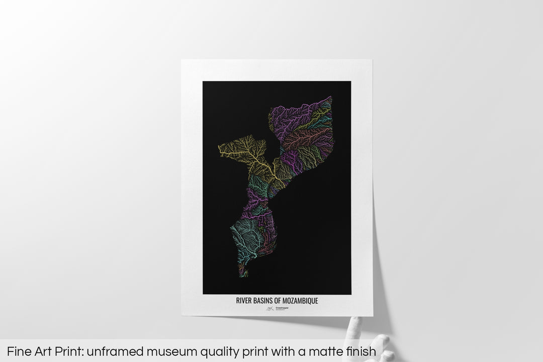 Unframed fine art print of a colourful map with a thick white mat. The title of the map and the Grasshopper Geography logo is printed on the mat, below the image. The map print lies flat on a white surface, a hand holding up one of the corners. The bottom text reads: Fine art print - unframed museum quality print with a matte finish.