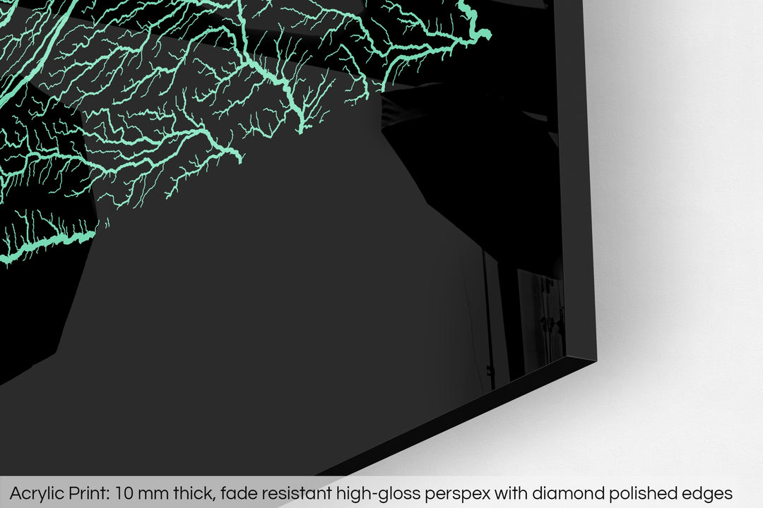 Closeup of an acrylic panel's corner, the details of a Grasshopper Geography map is visible. The text at the bottom reads: Acrylic print - 10 mm thick, fade reistant high-gloss perspex with diamond polished edges.