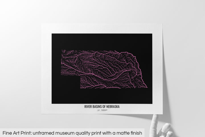 Unframed fine art print of a colourful map with a thick white mat. The title of the map and the Grasshopper Geography logo is printed on the mat, below the image. The map print lies flat on a white surface, a hand holding up one of the corners. The bottom text reads: Fine art print - unframed museum quality print with a matte finish.