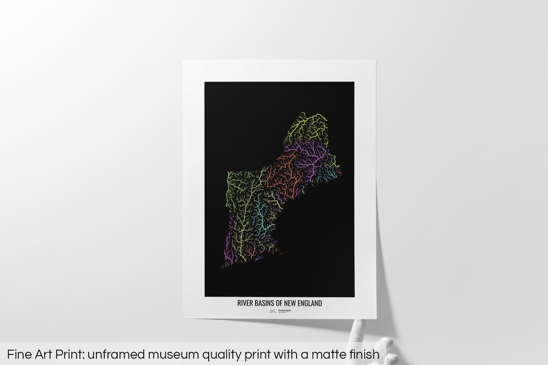 Unframed fine art print of a colourful map with a thick white mat. The title of the map and the Grasshopper Geography logo is printed on the mat, below the image. The map print lies flat on a white surface, a hand holding up one of the corners. The bottom text reads: Fine art print - unframed museum quality print with a matte finish.