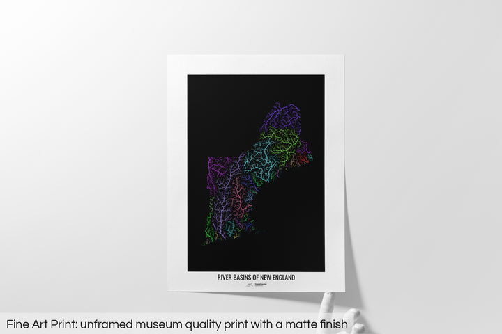 Unframed fine art print of a colourful map with a thick white mat. The title of the map and the Grasshopper Geography logo is printed on the mat, below the image. The map print lies flat on a white surface, a hand holding up one of the corners. The bottom text reads: Fine art print - unframed museum quality print with a matte finish.