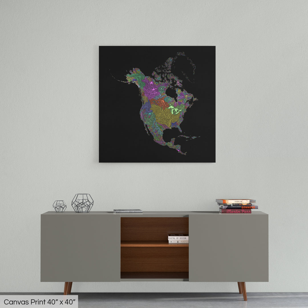 A colourful Grasshopper Geography map home decor in a living room, on a light grey wall. The map is printed on canvas and hangs above a modern low storage cabinet.
