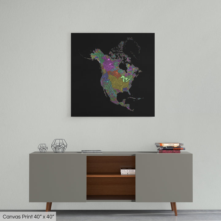 A colourful Grasshopper Geography map home decor in a living room, on a light grey wall. The map is printed on canvas and hangs above a modern low storage cabinet.