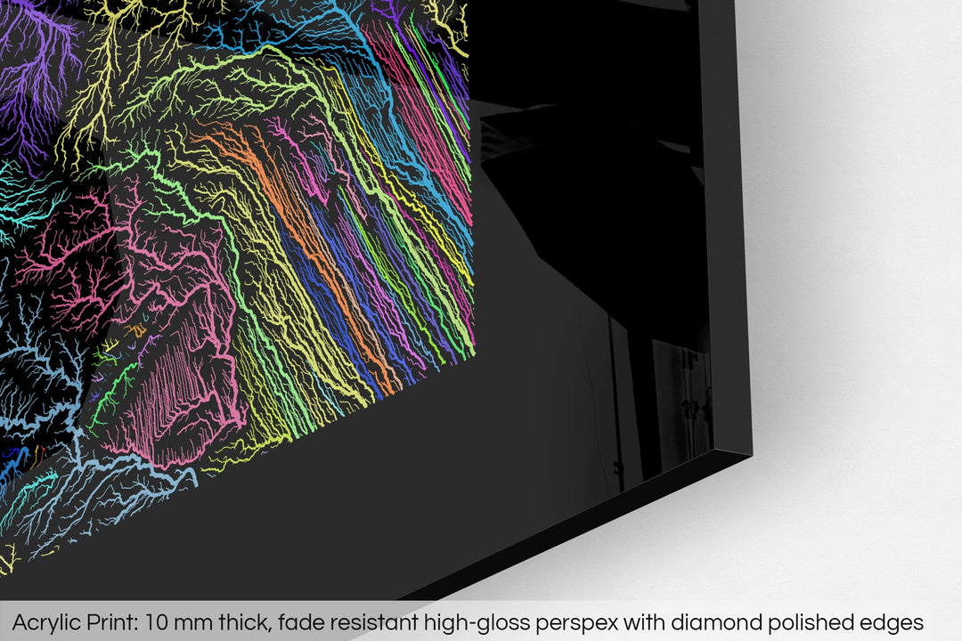 Closeup of an acrylic panel's corner, the details of a Grasshopper Geography map is visible. The text at the bottom reads: Acrylic print - 10 mm thick, fade reistant high-gloss perspex with diamond polished edges.