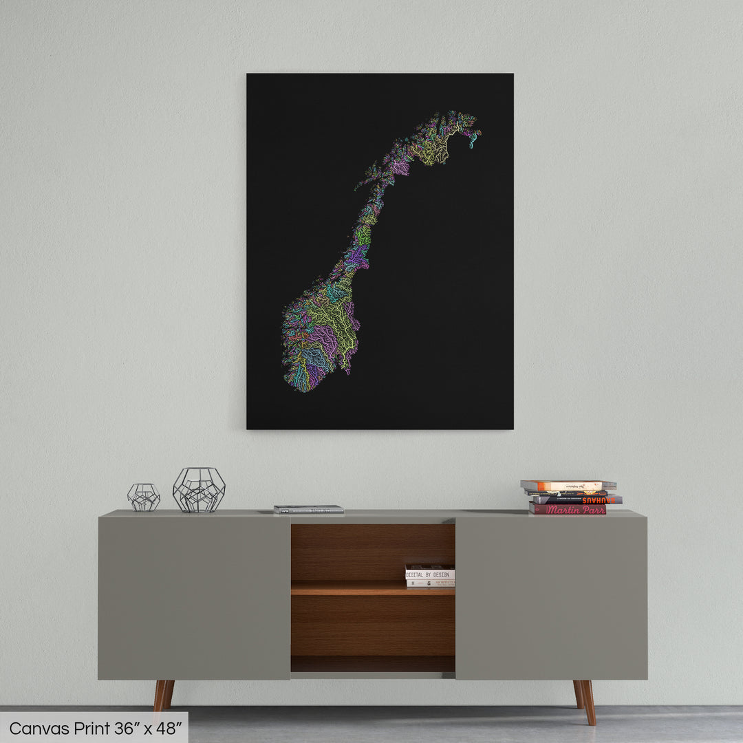 A colourful Grasshopper Geography map home decor in a living room, on a light grey wall. The map is printed on canvas and hangs above a modern low storage cabinet.